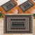A custom doormat featuring a vintage Fijian Tribal Tapa pattern with a personalized family name at the center.
